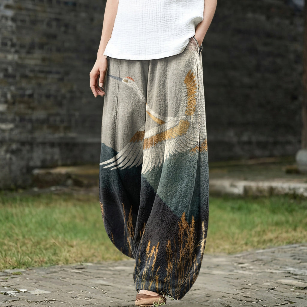 Margaux – Beige wide pants with a bird motif