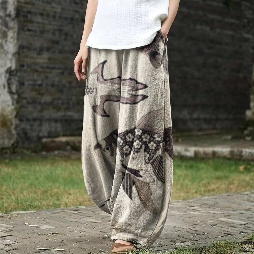 Hélène – Beige wide trousers with fish pattern