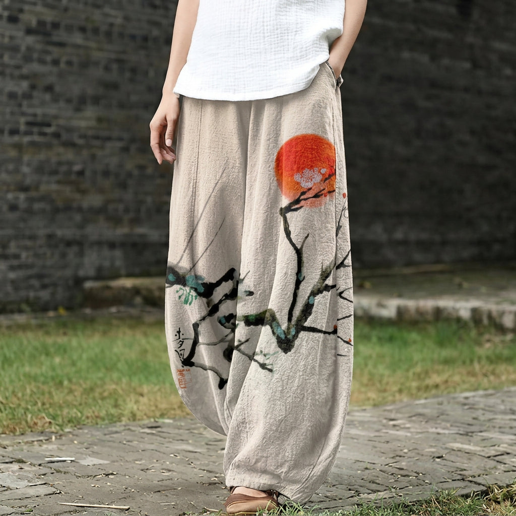 Léonie – Beige, wide pants with a sun motif in ink