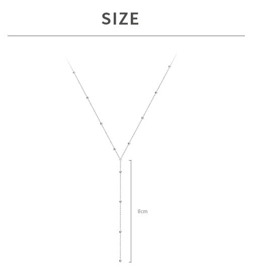 Necklace with tassels on the collarbones